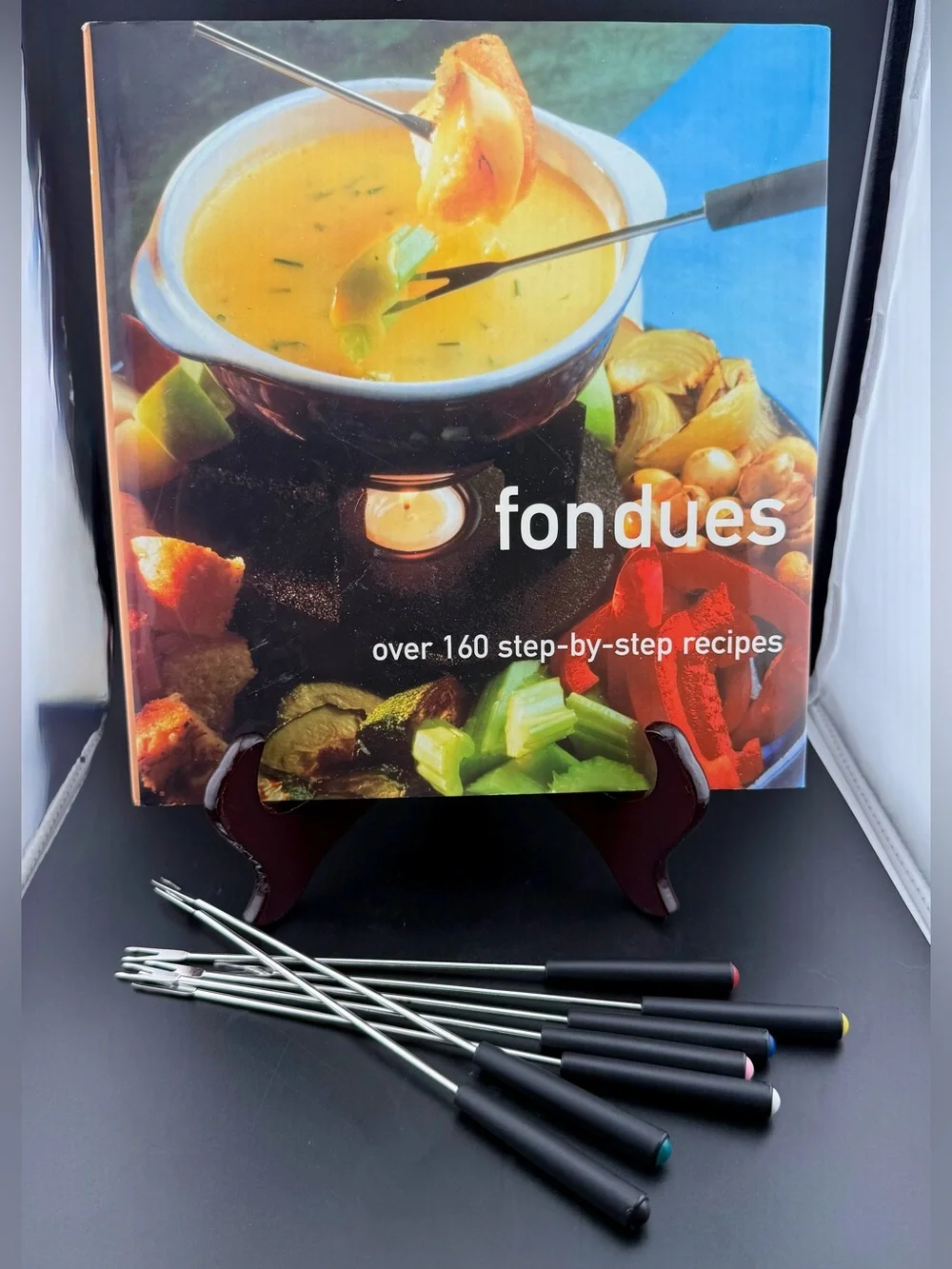 Hardcover cookbook Fondues: Over 160 Step-by-step Recipes. Stella Caldwell 2003